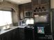 RV kitchen with sink, stove, microwave, fridge, and decorative accents at 109 Pembrooke Trl # F171, Mount Gilead, NC 27306