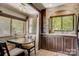 Open-concept kitchen seamlessly connected to the dining area, featuring stone wall accent and wood floors at 109 Pembrooke Trl # F171, Mount Gilead, NC 27306