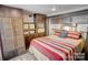 Well-appointed main bedroom with a queen size bed, storage options, and closet space at 109 Pembrooke Trl # F171, Mount Gilead, NC 27306