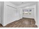 Bright bedroom with hardwood floors, large closet, and natural light from the windows at 1125 Mcdow Dr, Rock Hill, SC 29732
