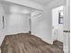 Spacious bedroom featuring hardwood floors, closet, and access to a half bath at 1125 Mcdow Dr, Rock Hill, SC 29732