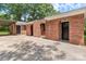 Charming red brick home with arched doorway, and a covered carport at 1125 Mcdow Dr, Rock Hill, SC 29732