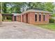 Lovely red brick home with carport, arched entryway, and well-maintained driveway at 1125 Mcdow Dr, Rock Hill, SC 29732