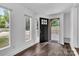 Inviting foyer with wood floors, white walls, and a modern front door at 1125 Mcdow Dr, Rock Hill, SC 29732