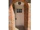 Inviting front entrance with a brick archway and stylish white door with glass insert at 1125 Mcdow Dr, Rock Hill, SC 29732