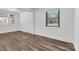 Bright living room with wood-look flooring, natural light, and view of backyard at 1125 Mcdow Dr, Rock Hill, SC 29732