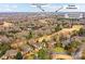 Wonderful aerial view of residential community, golf course, and Ballantyne Corporate Center at 11311 Mcclure Manor Dr, Charlotte, NC 28277