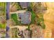 Aerial view of a beautiful house with lush landscaping, manicured lawns, and a private backyard at 11311 Mcclure Manor Dr, Charlotte, NC 28277