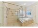 Bathroom featuring a glass-enclosed shower and separate soaking tub at 11311 Mcclure Manor Dr, Charlotte, NC 28277