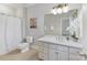 Bathroom with a single vanity sink and a shower with curtain at 11311 Mcclure Manor Dr, Charlotte, NC 28277