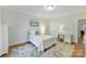 Cozy bedroom featuring a plush rug and a view of the yard at 11311 Mcclure Manor Dr, Charlotte, NC 28277