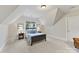 Cozy bedroom with a sloped ceiling, carpet, and natural light at 11311 Mcclure Manor Dr, Charlotte, NC 28277