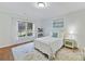 Comfortable bedroom featuring a large window and a bookcase at 11311 Mcclure Manor Dr, Charlotte, NC 28277
