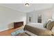 Bedroom boasts hardwood floors, natural light, and a dresser at 11311 Mcclure Manor Dr, Charlotte, NC 28277
