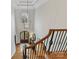 A well-lit foyer displays hardwood floors, a staircase, and views of the entrance at 11311 Mcclure Manor Dr, Charlotte, NC 28277