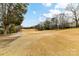 The sprawling golf course and surrounding greenery create a serene backdrop for the property at 11311 Mcclure Manor Dr, Charlotte, NC 28277