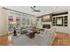 A bright living room offers a fireplace, built-in shelves, and a view of the backyard at 11311 Mcclure Manor Dr, Charlotte, NC 28277