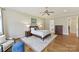 Bright main bedroom with hardwood floors, neutral walls, and access to the en suite bath at 11311 Mcclure Manor Dr, Charlotte, NC 28277
