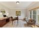 A home office features a hardwood desk, decorative rug, and large window at 11311 Mcclure Manor Dr, Charlotte, NC 28277