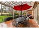 The spacious patio boasts a covered area and outdoor dining setup perfect for entertaining guests at 11311 Mcclure Manor Dr, Charlotte, NC 28277