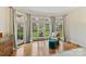 Charming sitting area with large windows offering views of the landscaped yard at 11311 Mcclure Manor Dr, Charlotte, NC 28277