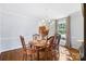 Dining room features a wooden dining table and chairs with a chandelier and natural light at 1148 Turnbridge Rd, Charlotte, NC 28226