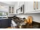 Granite countertops, stainless appliances, white cabinets in a kitchen with a view from the window at 1148 Turnbridge Rd, Charlotte, NC 28226
