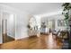 Bright living room featuring hardwood floors, stylish decor, and neutral tones creating a welcoming atmosphere at 1148 Turnbridge Rd, Charlotte, NC 28226