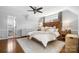 Neutral colored main bedroom with hardwood flooring, natural light, and neutral decor at 1148 Turnbridge Rd, Charlotte, NC 28226