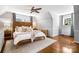 Main bedroom with vaulted ceilings and a wood accent wall behind the bed and soft, neutral decor at 1148 Turnbridge Rd, Charlotte, NC 28226