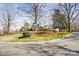 A view of the property from the street showcases the home's landscaping and neighborhood at 1148 Turnbridge Rd, Charlotte, NC 28226