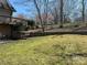 Spacious backyard featuring tiered retaining walls and lush green grass on a sunny day at 1220 Nw 20Th Avenue Nw Ave, Hickory, NC 28601