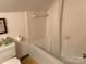 Tiled bathroom with shower-tub combo and basic fixtures; functional and clean at 1220 Nw 20Th Avenue Nw Ave, Hickory, NC 28601