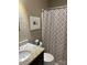 Bathroom with granite countertop, white toilet, and white shower curtain at 1220 Nw 20Th Avenue Nw Ave, Hickory, NC 28601