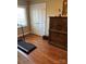 Comfortable bedroom space with hardwood floors and a treadmill, providing convenience for exercise at home at 1220 Nw 20Th Avenue Nw Ave, Hickory, NC 28601