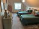 Cozy bedroom featuring two twin beds, neutral carpet, and natural light from window at 1220 Nw 20Th Avenue Nw Ave, Hickory, NC 28601