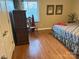 Bedroom featuring hardwood floors, patterned bedspread, and natural light at 1220 Nw 20Th Avenue Nw Ave, Hickory, NC 28601