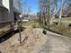 View of the driveway and landscaped yard with a wood deck and American flag at 1220 Nw 20Th Avenue Nw Ave, Hickory, NC 28601