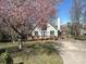 Charming home featuring a well-manicured lawn, blossoming tree, and inviting deck at 1220 Nw 20Th Avenue Nw Ave, Hickory, NC 28601
