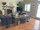 Comfortable living room featuring a stone fireplace, mounted television, and hardwood floors at 1220 Nw 20Th Avenue Nw Ave, Hickory, NC 28601