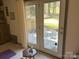 Open doors revealing outdoor patio with seating area overlooking the backyard, perfect for entertaining guests at 1220 Nw 20Th Avenue Nw Ave, Hickory, NC 28601