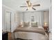 Cozy bedroom with neutral tones, ceiling fan, and white curtains at 125 Ashe St, Gastonia, NC 28056