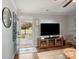 Inviting living room with wood flooring, featuring a modern tv set, and natural light at 125 Ashe St, Gastonia, NC 28056