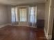 Bedroom with hardwood floors and a door to the outdoors at 129 Maupin Ave, Salisbury, NC 28144