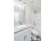 Clean bathroom showcasing a vanity with granite countertop, a mirror, and a shower-tub combination at 1308 Jay Ave, Gastonia, NC 28052
