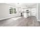 Well-lit kitchen with white cabinets, stainless steel appliances, and a center island at 1308 Jay Ave, Gastonia, NC 28052