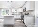 Stylish kitchen featuring white cabinets, granite countertops, and stainless steel appliances at 1308 Jay Ave, Gastonia, NC 28052