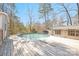 Outdoor pool and deck is perfect for gatherings with ample seating and recreational space at 140 Sanford Ln, Badin Lake, NC 28127