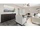 Well-decorated living room with an art piece, dark wood cabinet, light-colored flooring, and stylish furniture at 140 Sanford Ln, Badin Lake, NC 28127