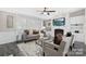 Stylish living room with a fireplace, built-in shelves, and large windows, creating a bright, inviting space at 140 Sanford Ln, Badin Lake, NC 28127